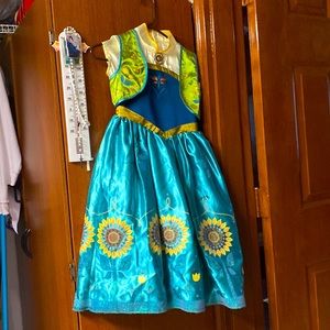This a princess Ana costume dress with a jacket in size 7/8 by the Disney store